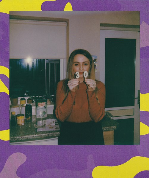 picture-of-woman-holding-30-number-signage-3581695